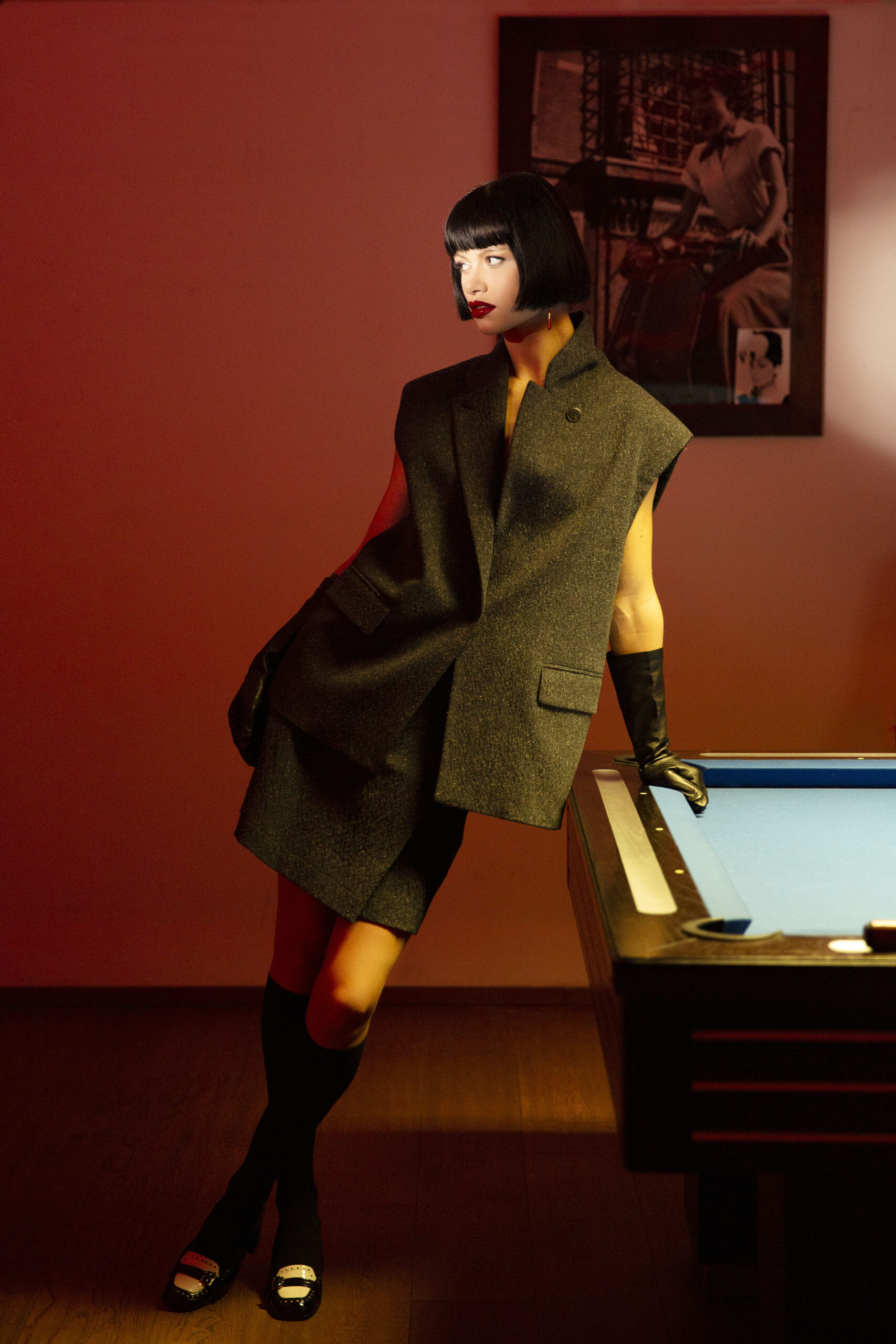 WOMENLAYING ON A BILLIARD TABLE