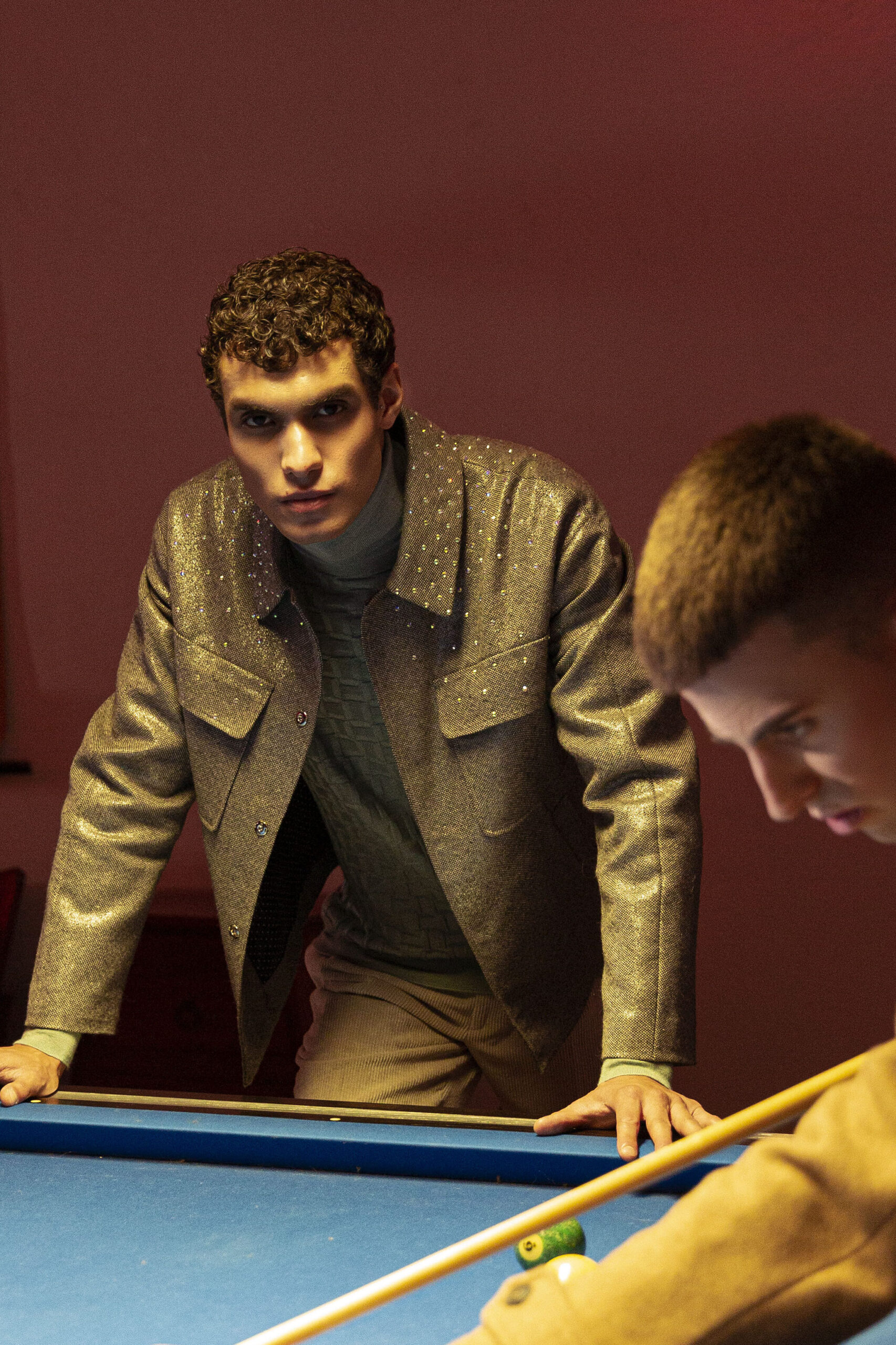 TWO MEN PLAYING BILLIARD